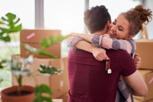 buying a home with couple hugging