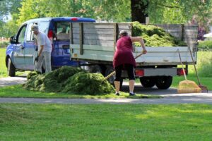 low cost way for sprucing up your homes exterior image of people doing yardwork